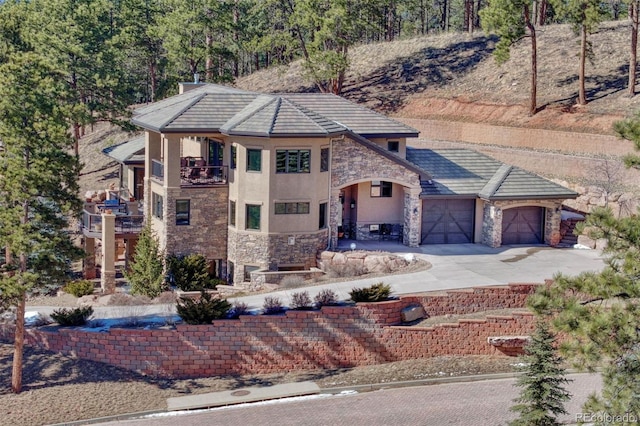 view of front of house with a balcony and a garage