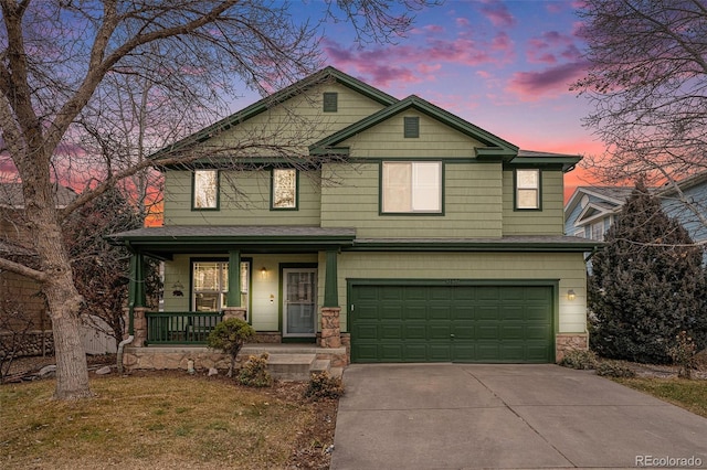 view of front of property featuring a porch and a garage