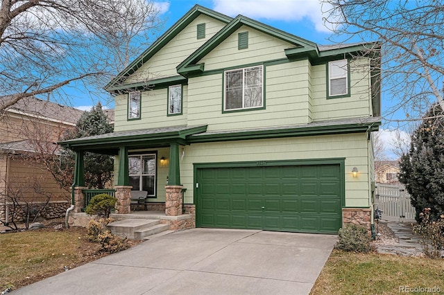 view of front of house featuring a porch and a garage