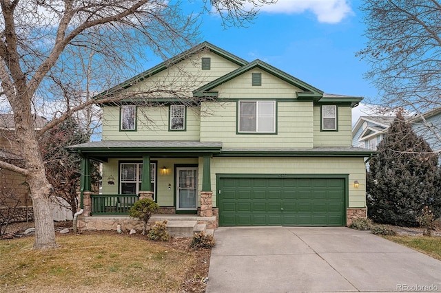 view of front of property featuring a garage and covered porch