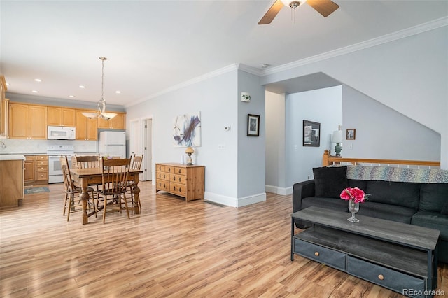 living room with crown molding, ceiling fan, and light wood-type flooring