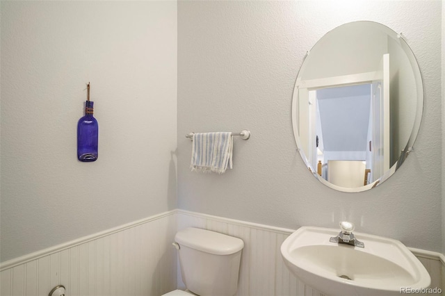 bathroom with sink and toilet