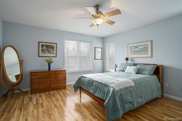 bedroom with hardwood / wood-style flooring and ceiling fan