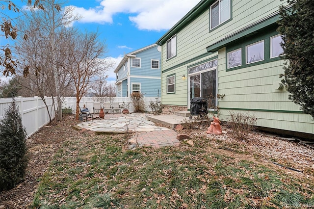 back of property with a patio