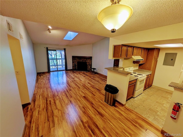 kitchen with brown cabinets, a fireplace, white electric range, light wood-type flooring, and electric panel