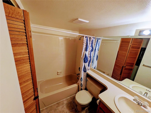 bathroom with shower / bath combo, vanity, toilet, a textured ceiling, and visible vents