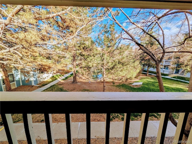 view of yard with a balcony