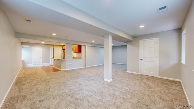 1229 Berganot Trl, Castle Pines, CO 80108 - finished below grade area with light carpet, refrigerator, baseboards, and recessed lighting