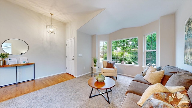 1229 Berganot Trl, Castle Pines, CO 80108 - living area with carpet floors, baseboards, and a chandelier