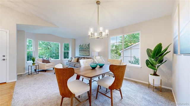 1229 Berganot Trl, Castle Pines, CO 80108 - dining space featuring a chandelier, light carpet, and baseboards