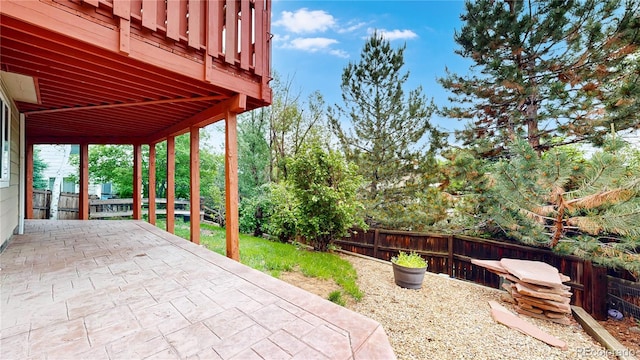 1229 Berganot Trl, Castle Pines, CO 80108 - fenced backyard with a patio area