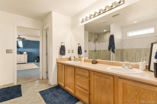 11885 Helena St, Commerce City, CO 80022 - bathroom featuring vanity, tiled shower, parquet floors, and ceiling fan