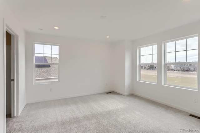 empty room featuring light colored carpet