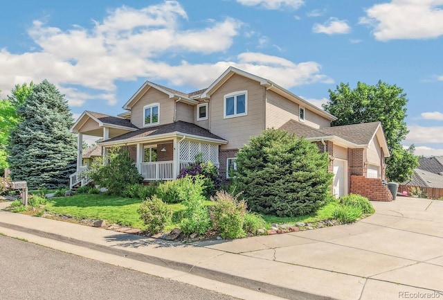 942 Xenon Ct, Golden, CO 80401 - traditional-style home featuring brick siding, concrete driveway, a garage, and covered porch