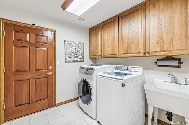 942 Xenon Ct, Golden, CO 80401 - washroom featuring cabinet space, separate washer and dryer, and light tile patterned floors