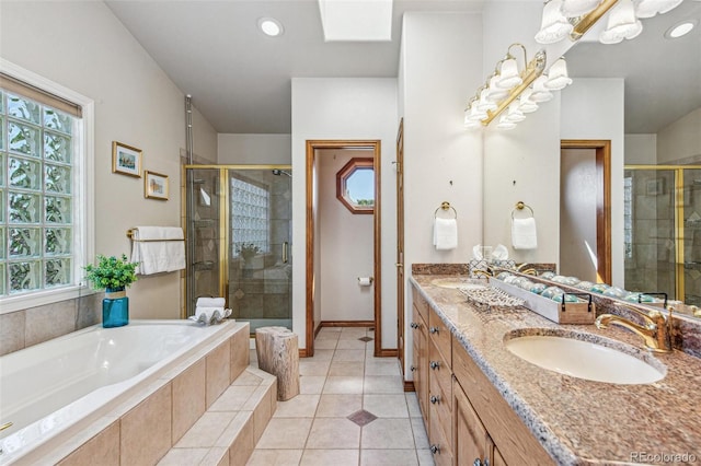 942 Xenon Ct, Golden, CO 80401 - bathroom featuring a shower stall, double vanity, a garden tub, tile patterned flooring, and recessed lighting