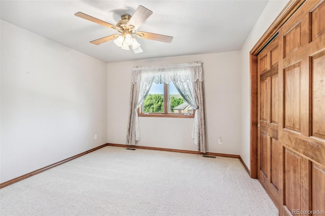 942 Xenon Ct, Golden, CO 80401 - unfurnished bedroom featuring light carpet and a ceiling fan