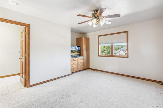 942 Xenon Ct, Golden, CO 80401 - unfurnished bedroom featuring light carpet and a ceiling fan