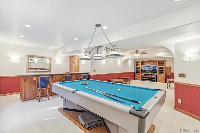 942 Xenon Ct, Golden, CO 80401 - rec room with light carpet, pool table, a wainscoted wall, bar with sink, and ceiling fan