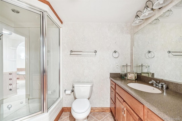 942 Xenon Ct, Golden, CO 80401 - bathroom featuring vanity, tile patterned floors, and combined bath / shower with glass door