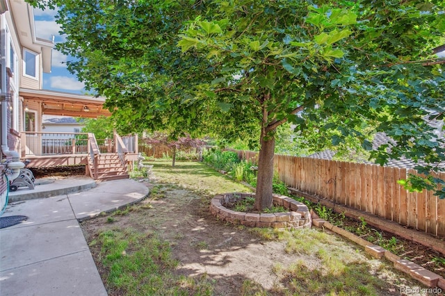 942 Xenon Ct, Golden, CO 80401 - fenced backyard with a wooden deck