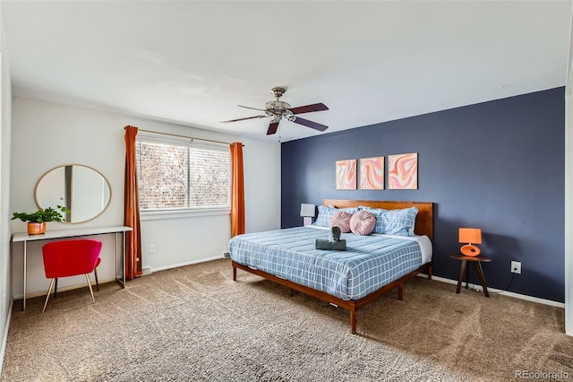 carpeted bedroom featuring ceiling fan and baseboards