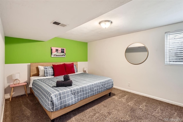 carpeted bedroom featuring visible vents and baseboards
