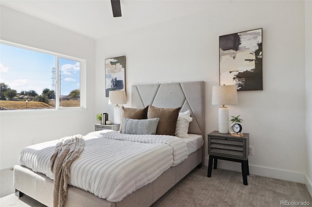 bedroom with carpet, baseboards, and ceiling fan