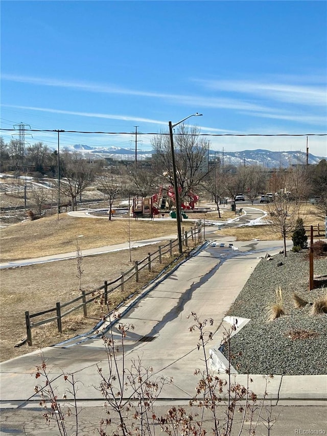 view of yard featuring a mountain view and playground community