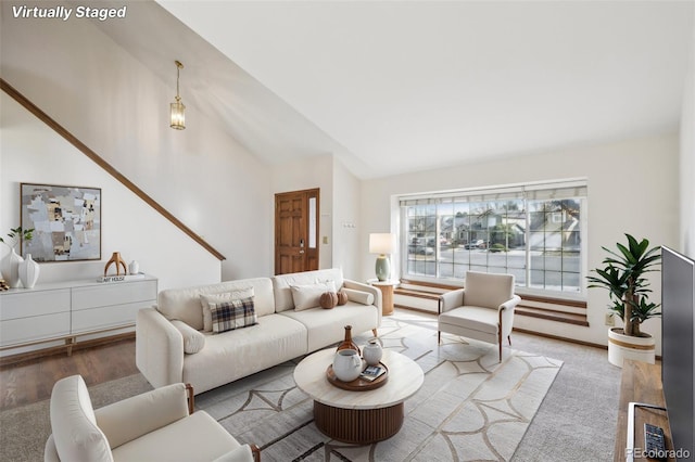 living room featuring vaulted ceiling