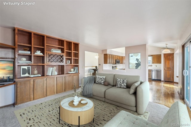 living area with light wood finished floors and baseboards