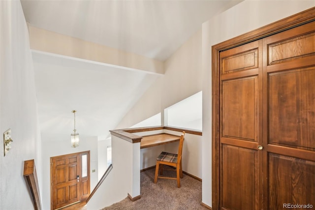 additional living space featuring carpet floors, vaulted ceiling with beams, and baseboards