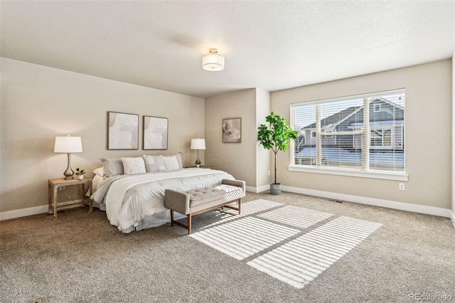 carpeted bedroom with a textured ceiling