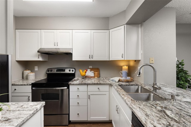 kitchen with light stone countertops, sink, white cabinetry, and electric stove