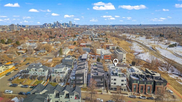 drone / aerial view featuring a residential view and a city view