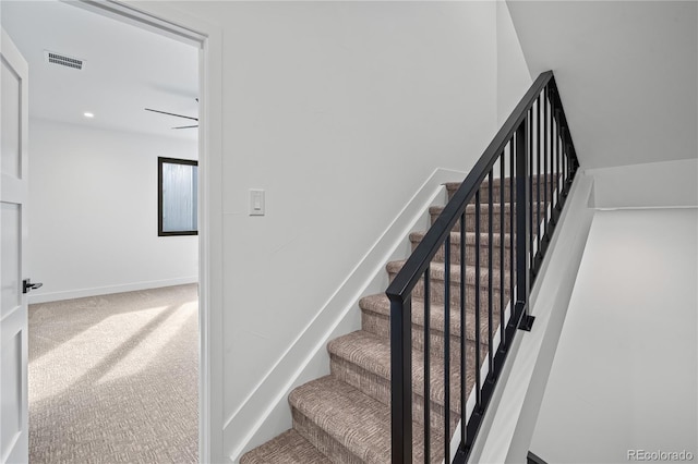 staircase with baseboards, visible vents, carpet flooring, and recessed lighting