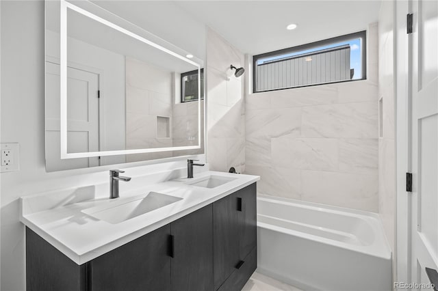 bathroom featuring double vanity, recessed lighting, a sink, and bathing tub / shower combination