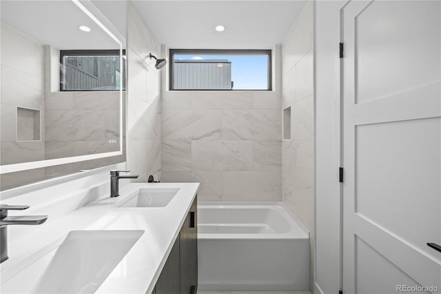 full bathroom featuring double vanity, shower / bathing tub combination, a sink, and recessed lighting