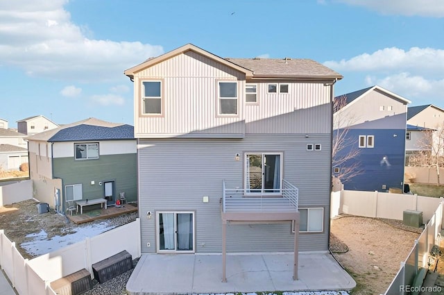 back of house featuring central air condition unit