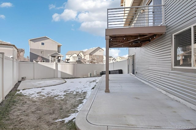 view of patio featuring a balcony