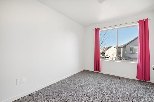 spare room featuring carpet flooring