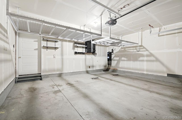 garage with electric panel and a garage door opener