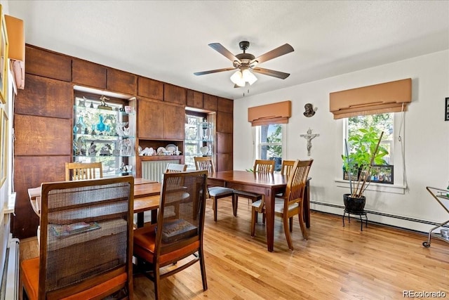 7750 W 5th Ave, Lakewood, CO 80226 - dining area with ceiling fan, light wood-type flooring, and baseboard heating