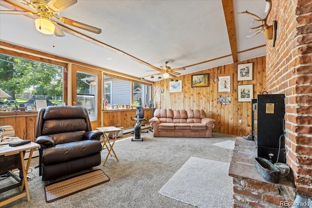 7750 W 5th Ave, Lakewood, CO 80226 - carpeted living area with a ceiling fan, healthy amount of natural light, and wooden walls