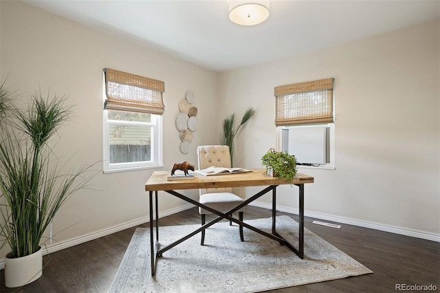 office with dark wood-type flooring