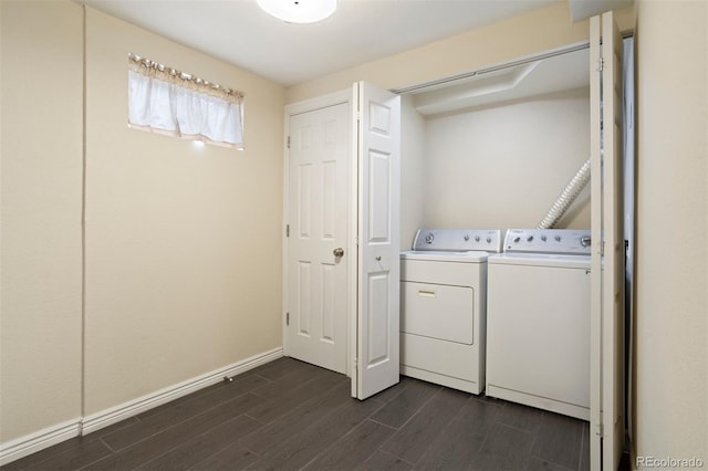 laundry room featuring washer and dryer and dark hardwood / wood-style floors