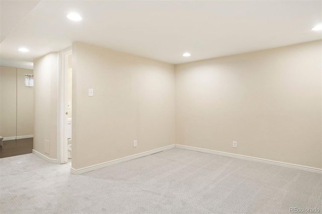 spare room with light carpet