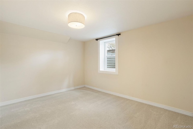 unfurnished room featuring carpet