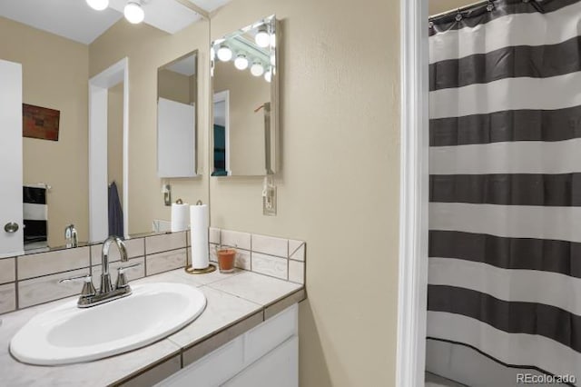bathroom with vanity and curtained shower