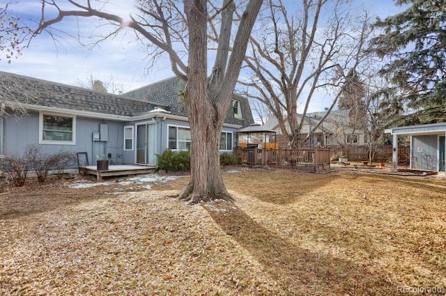 view of yard featuring a wooden deck